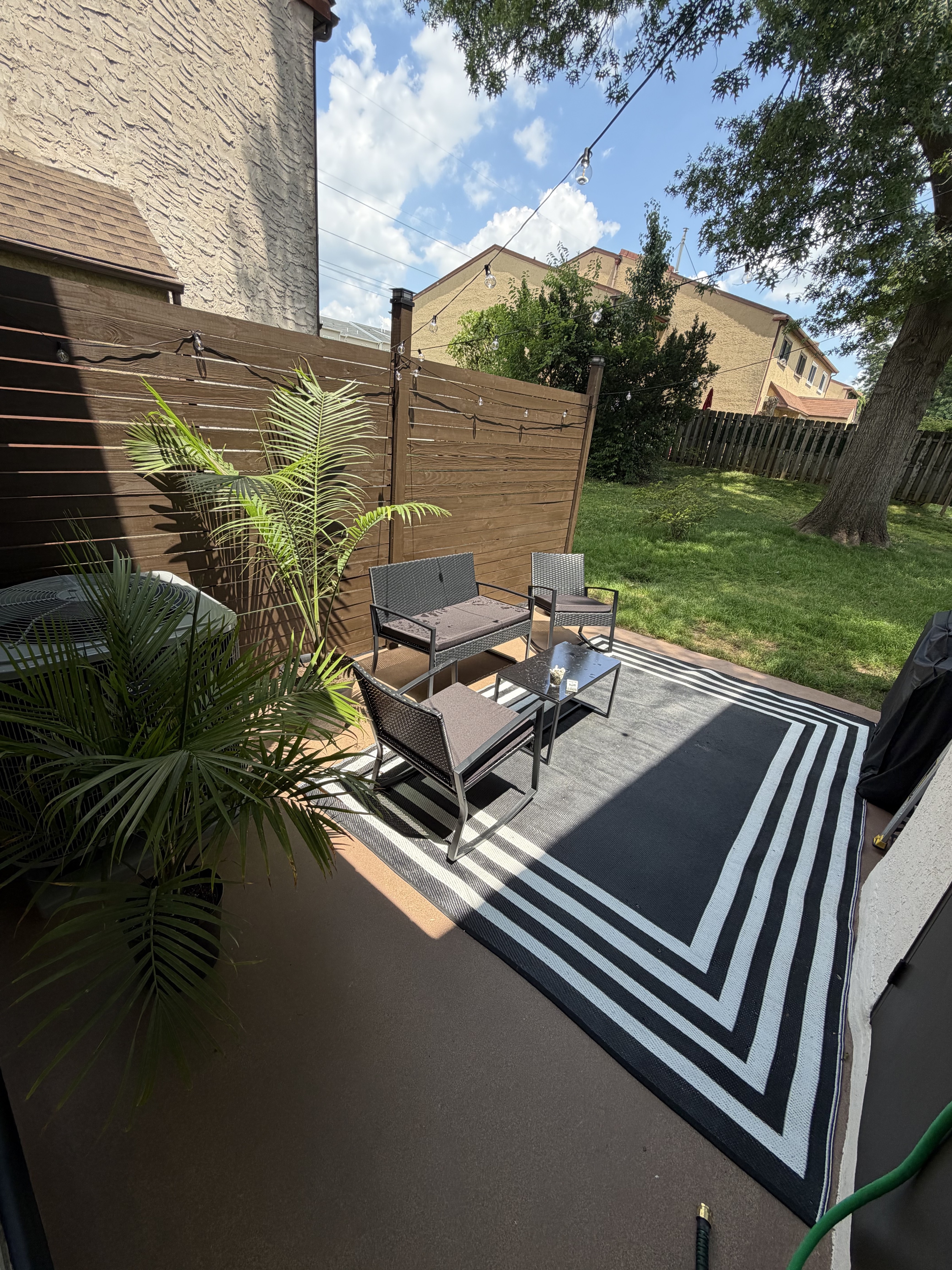 Backyard patio and privacy fence after remodeling